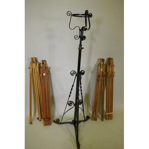 1061 - Three Winsor and Newton field easels, a similar Daler Rowney easel, and a painted metal torchere, 13... 