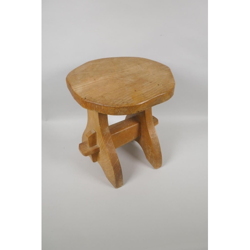 1062 - A rustic pegged elm stool, 30cm high