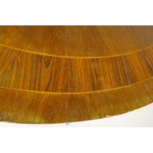 1064 - C19th tilt top breakfast table, the top with rosewood banding and fiddle back veneer, raised on an o... 