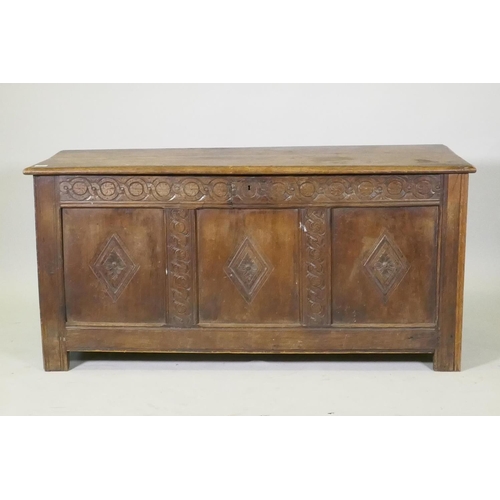 1067 - An C18th three panel coffer with carved frieze and panelled sides, raised on stile supports, AF repa... 