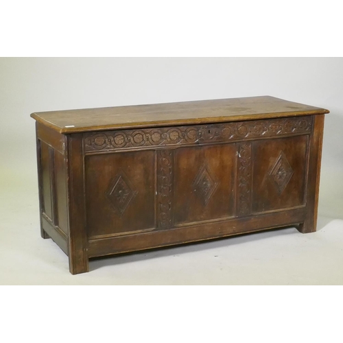 1067 - An C18th three panel coffer with carved frieze and panelled sides, raised on stile supports, AF repa... 