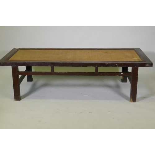 1068 - An antique Chinese hardwood day bed with rattan top, later adaptions, 168 x 72cm, 45cm high