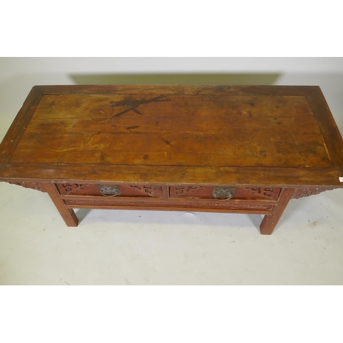 1069 - A Chinese lacquered wood two drawer occasional table with carved details, 154 x 64cm, 49cm high