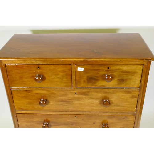 1077 - A Victorian mahogany chest of two over three drawers, with roundel corners and turned wood handles, ... 