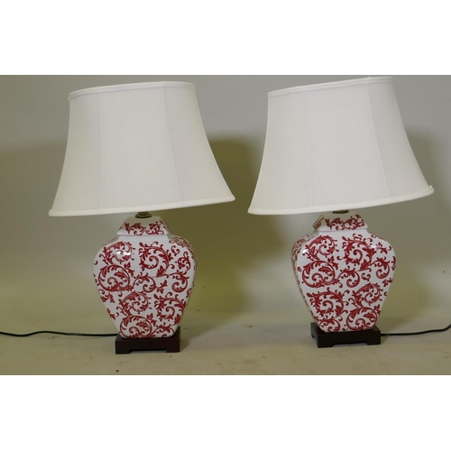 108 - A pair of oriental ceramic table lamps with foliate decoration and linen shades, as new, lamp 40cm, ... 