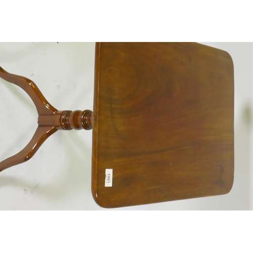 1081 - A Victorian mahogany tilt top occasional table, raised on a turned column and tripod supports, 54 x ... 