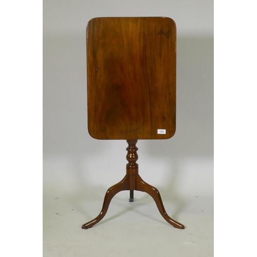 1081 - A Victorian mahogany tilt top occasional table, raised on a turned column and tripod supports, 54 x ... 