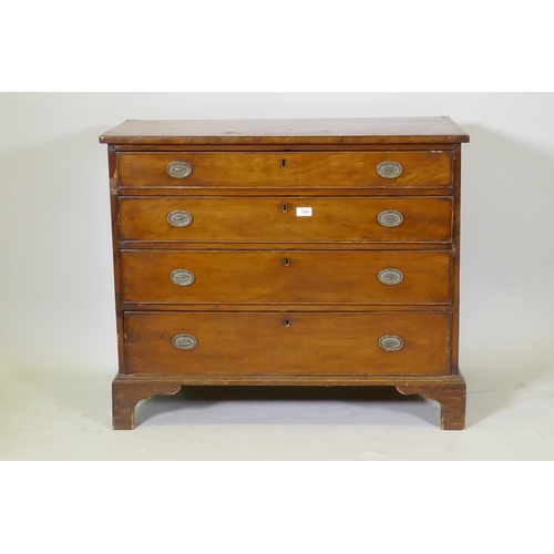 1084 - A Georgian mahogany chest of four long drawers with cockbeaded fronts, oak linings and brass plate h... 