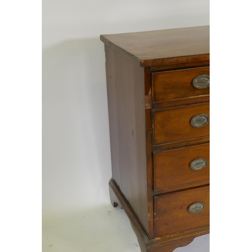 1084 - A Georgian mahogany chest of four long drawers with cockbeaded fronts, oak linings and brass plate h... 