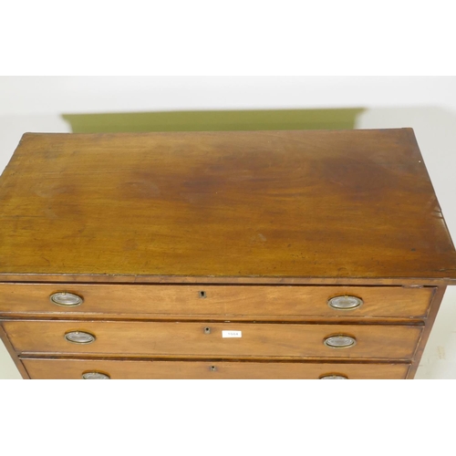 1084 - A Georgian mahogany chest of four long drawers with cockbeaded fronts, oak linings and brass plate h... 