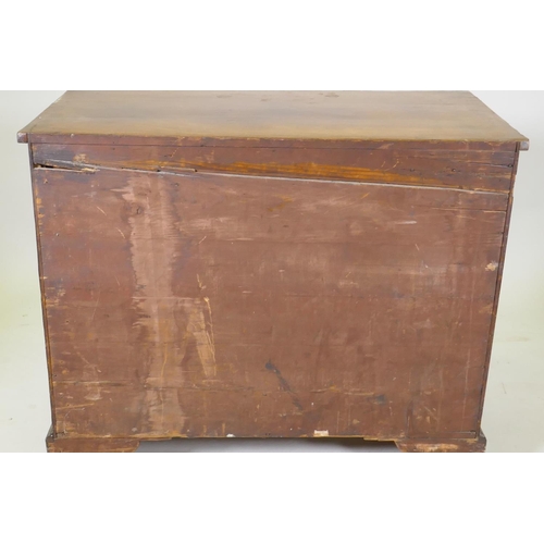 1084 - A Georgian mahogany chest of four long drawers with cockbeaded fronts, oak linings and brass plate h... 