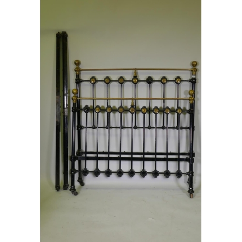 1086 - A Victorian cast iron and brass bed, 146cm high, 140cm wide, 194cm long