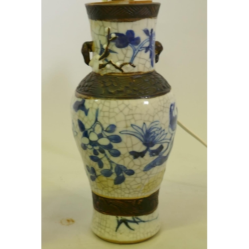 109 - A pair of antique Chinese crackleware vases with blue and white decoration, converted to table lamps... 