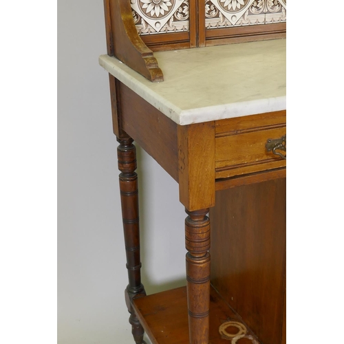 1097 - A Victorian walnut marble top washstand with tiled and mirror back over a single drawer and pot cupb... 