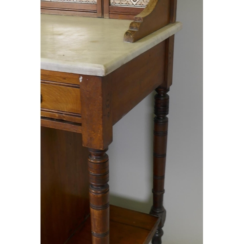 1097 - A Victorian walnut marble top washstand with tiled and mirror back over a single drawer and pot cupb... 