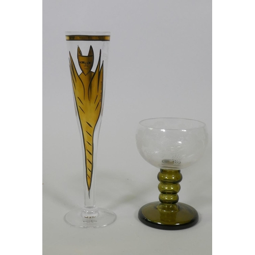 11 - A Kosta Boda glass drinking flute, with painted and gilt decoration signed by Ulrica Hundman-Vallien... 