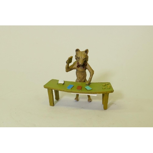 110 - A cold painted bronze figure of a fox dealing cards, 9cm high