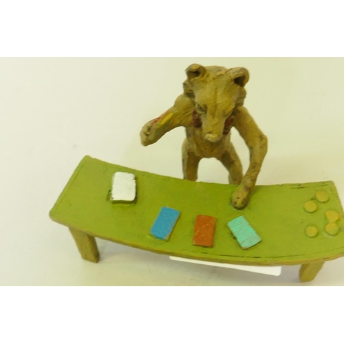 110 - A cold painted bronze figure of a fox dealing cards, 9cm high