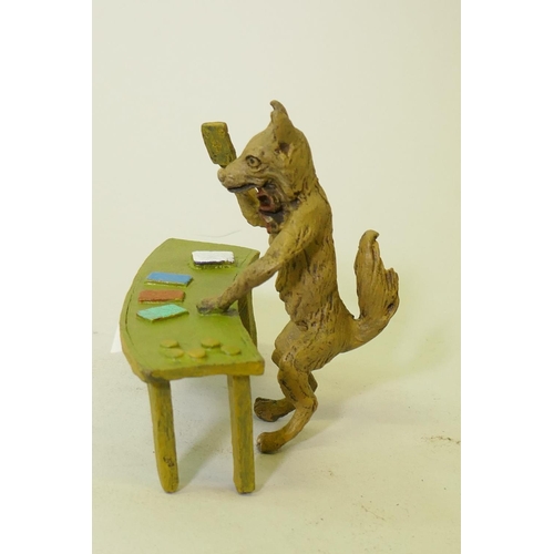 110 - A cold painted bronze figure of a fox dealing cards, 9cm high