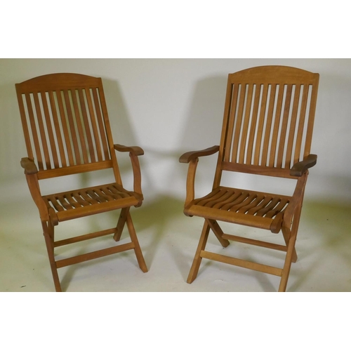 1104 - A set of eight Regency teak folding garden chairs