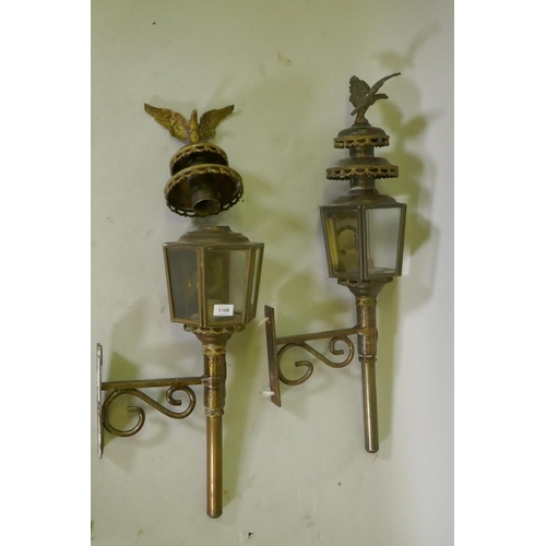 1106 - A pair of metal wall lanterns with candle lights, 84cm high