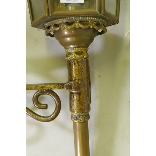 1106 - A pair of metal wall lanterns with candle lights, 84cm high