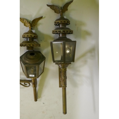 1106 - A pair of metal wall lanterns with candle lights, 84cm high