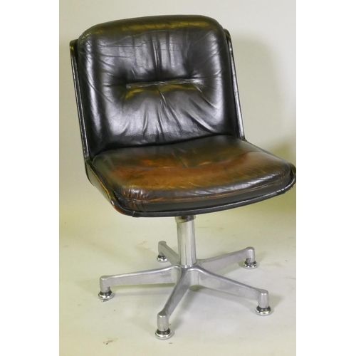 1108 - A pair of mid century leather swivel chairs, raised on polished aluminium spider leg bases, stamped ... 