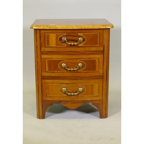 1109 - A Maltese marquetry inlaid three drawer bow fronted commode, with brass handles, raised on shaped su... 