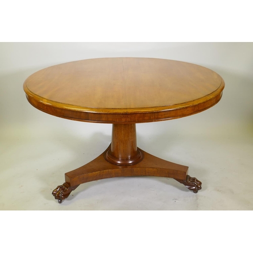 1111 - A Victorian mahogany tilt top breakfast table, raised on a column and triform base with claw feet an... 