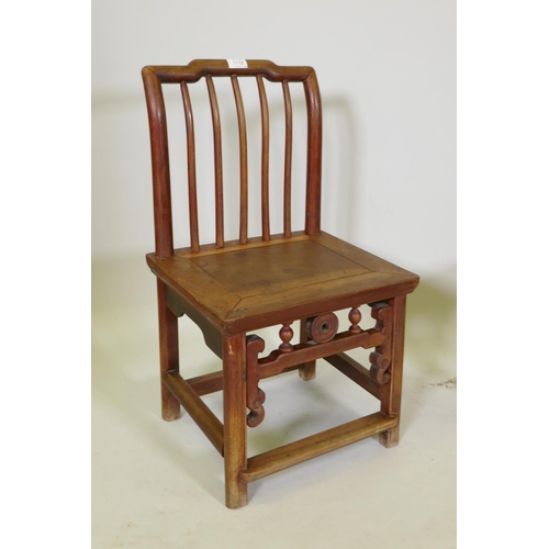 1112 - A near pair of Chinese elm spindle back low chairs, 70cm high