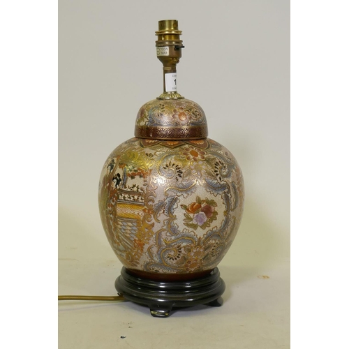 112 - An oriental porcelain table lamp, decorated in Japanese style with gilt highlights, 35cm high