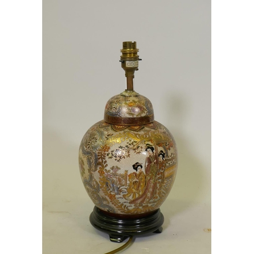 112 - An oriental porcelain table lamp, decorated in Japanese style with gilt highlights, 35cm high