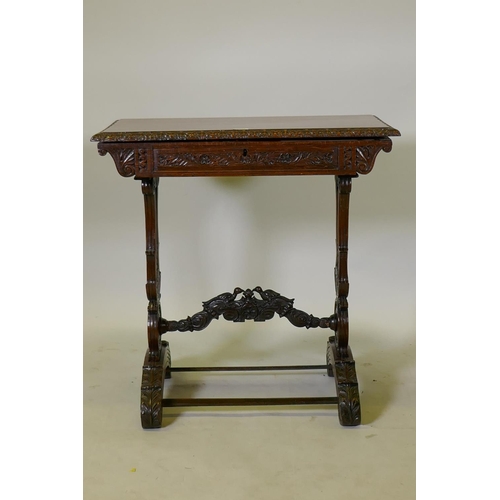 1121 - A C19th Colonial  Anglo-Indian padouk work/dressing table, with lift up top and removable fitte... 