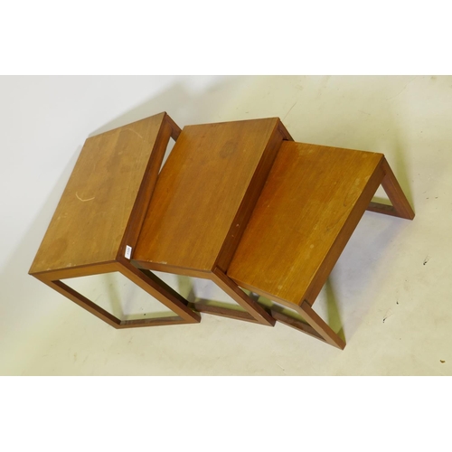 1125 - A nest of three teak veneered occasional tables, 61 x 41 x 46cm