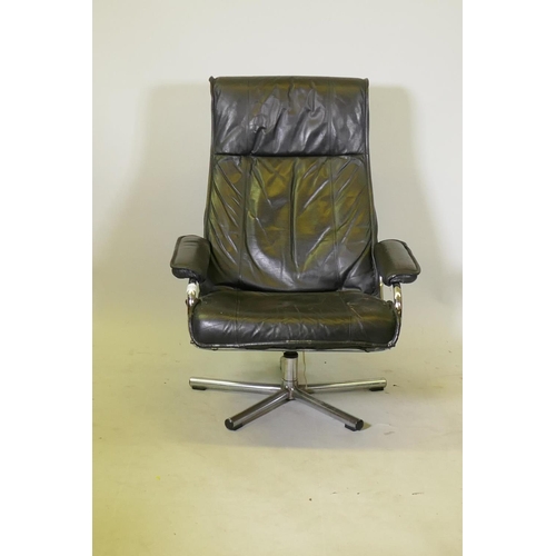 1127 - Kebe Danish leather reclining and swivel action arm chair, c.1970/80