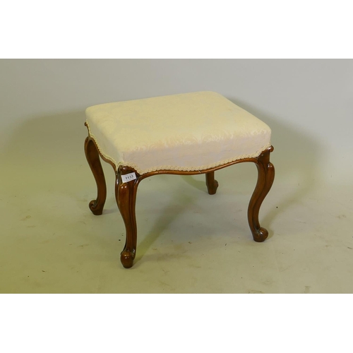 1133 - A Victorian walnut stool with damask upholstery, raised on cabriole supports, 46 x 46 x 39cm