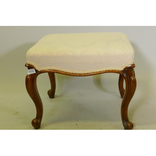 1133 - A Victorian walnut stool with damask upholstery, raised on cabriole supports, 46 x 46 x 39cm