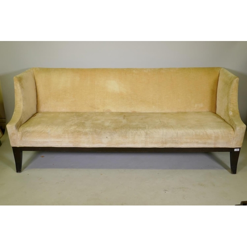 1135 - A contemporary settee with shaped arms and ebonised frame, raised on swept supports, 198 x 67 x 77cm