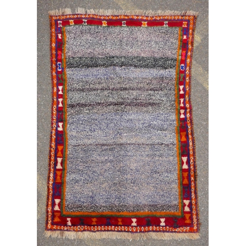 1137 - A Persian Ghashghai Gabbeh hand spun wool full pile nomad rug, with grey field and red and orange bo... 