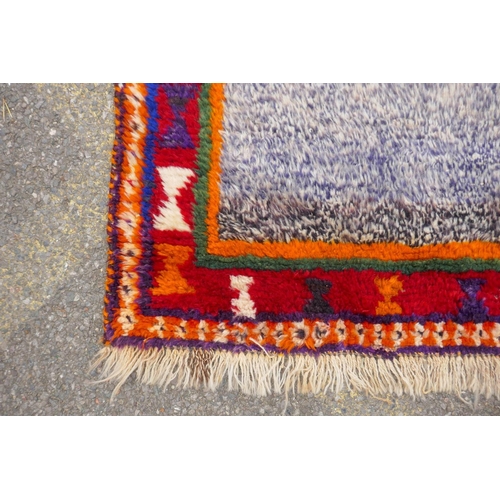 1137 - A Persian Ghashghai Gabbeh hand spun wool full pile nomad rug, with grey field and red and orange bo... 