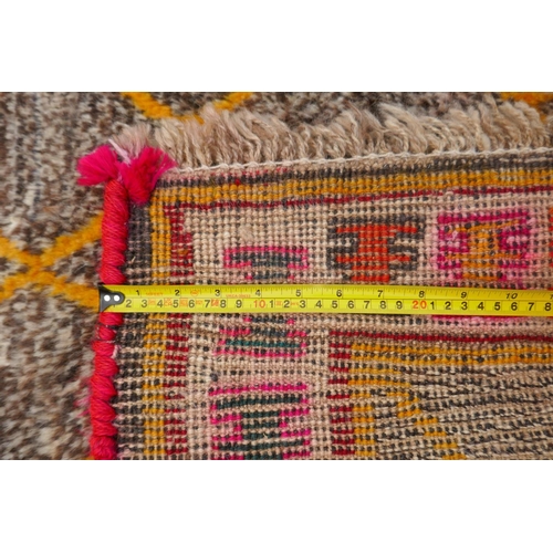 1138 - A Persian Ghashghai Gabbeh hand spun wool full pile nomad rug with a yellow diamond design on a grey... 