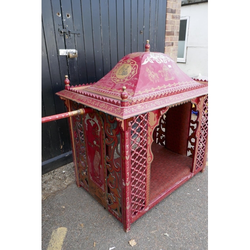 1141 - An Indian palanquin/sedan chair with painted and applied decoration and open fretwork sides, 137 x 9... 