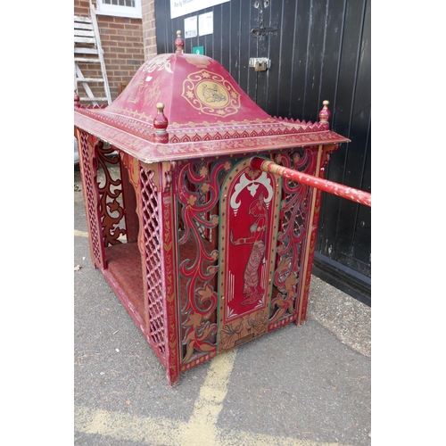 1141 - An Indian palanquin/sedan chair with painted and applied decoration and open fretwork sides, 137 x 9... 