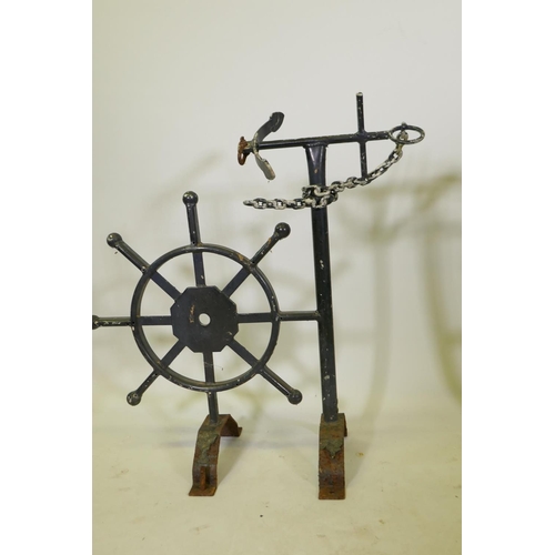 1147 - A pair of painted metal wall brackets with ship's wheel and anchor, by repute from the Royal Naval C... 