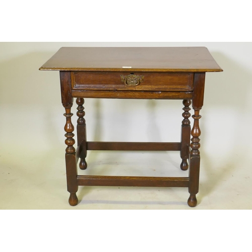 1149 - A William and Mary oak single drawer side table, raised on turned supports, united by stretchers, c.... 