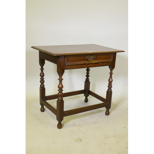 1149 - A William and Mary oak single drawer side table, raised on turned supports, united by stretchers, c.... 