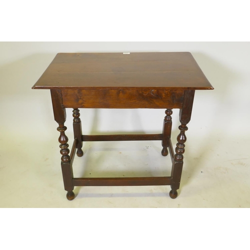 1149 - A William and Mary oak single drawer side table, raised on turned supports, united by stretchers, c.... 