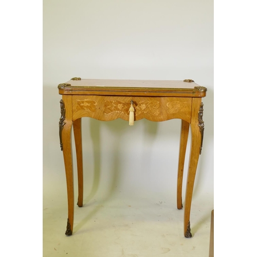 1150 - A French marquetry inlaid rosewood card table with brass mounts, the top slide back to reveal a writ... 