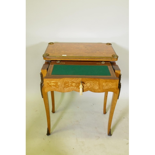 1150 - A French marquetry inlaid rosewood card table with brass mounts, the top slide back to reveal a writ... 